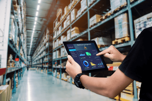 Man holding ipad warehouse