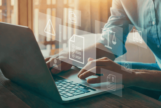 Person with laptop and regulatory icons