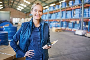 Woman holding ipad in Chemical plant