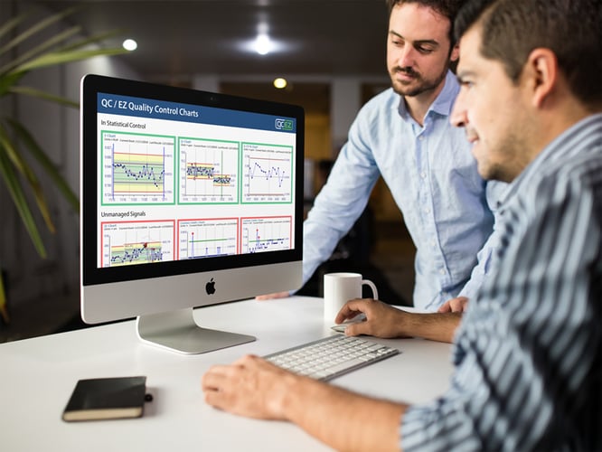 LAB-29-two-men-at-the-office-using-an-imac-mockup-a16261