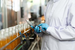 Worker at beverage bottle filling station